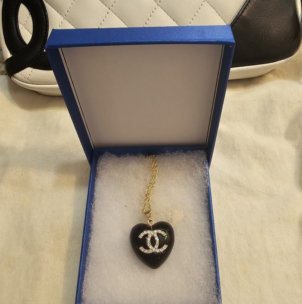 Gold-Tone Chain With Enamel Black Heart Pendant with Sparkling Logo Accent